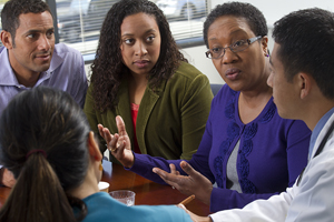 You can meet with the health care provider and health care team to learn more. A woman and her family are discussing artificial feeding with her health care provider and health care team.